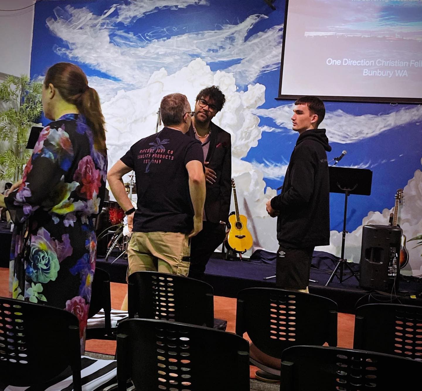 Church congregation with hands raised in worship